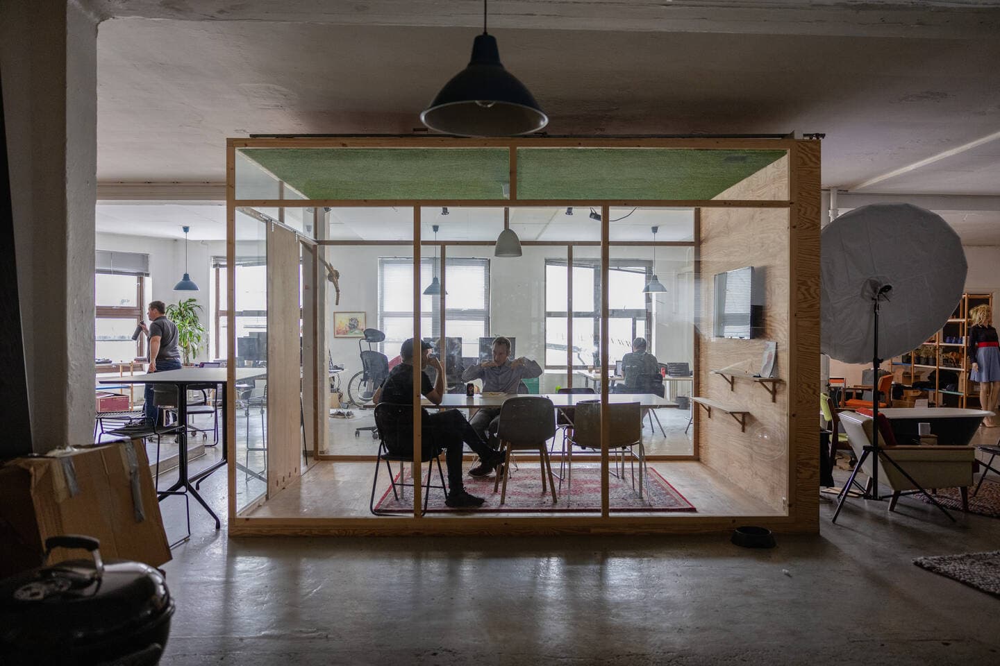 Two people talking in a meeting room